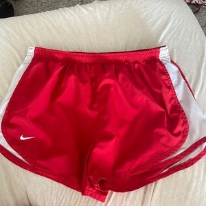 Red Nike running shorts